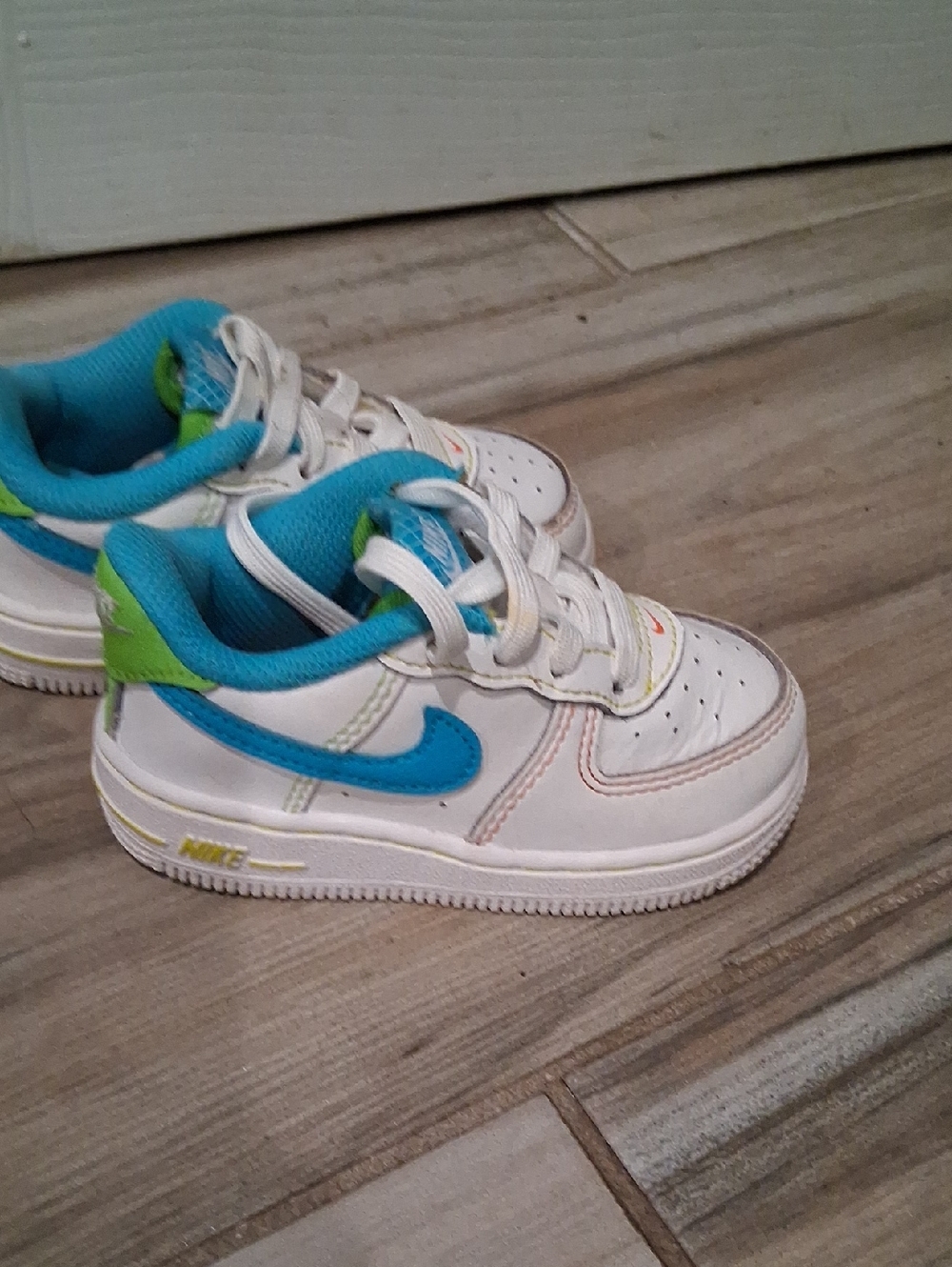 Nike Kids White Sneakers with Blue & Green Accents